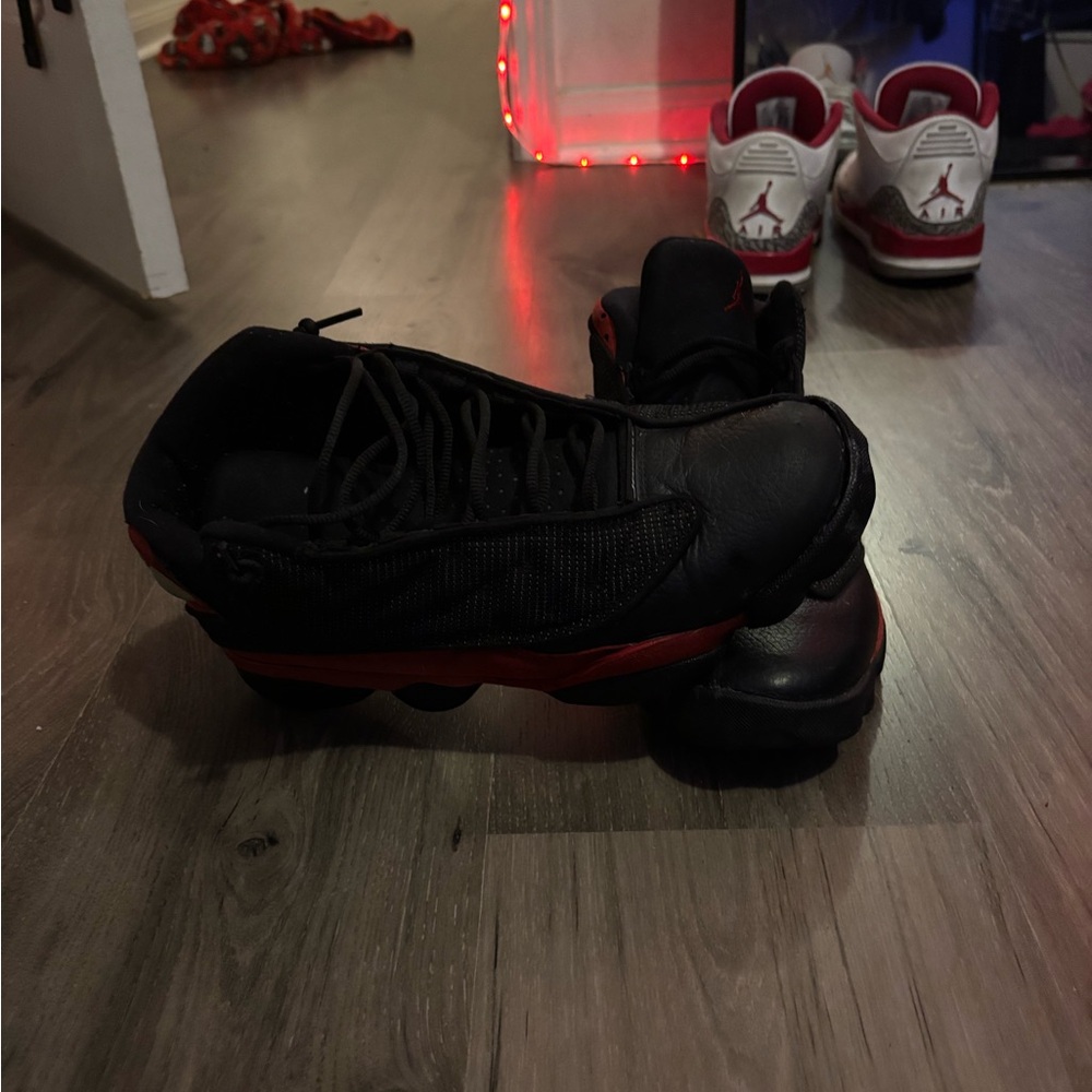 Red and black Jordan 13s